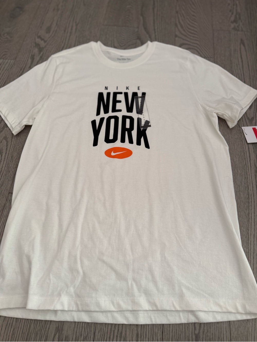 Nike White Short-Sleeve Tee with Black New York Graphic & Orange Swoosh